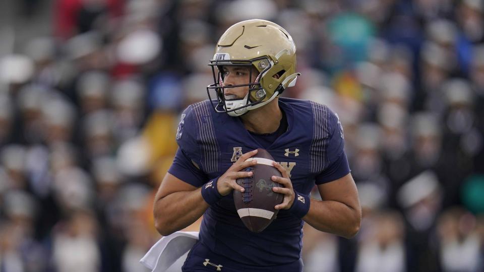 FILE - Navy quarterback Tai Lavatai drops back to pass against Tulsa during the first half of an NCAA college football game, Oct. 8, 2022, in Annapolis, Md. Notre Dame will face Navy in Dublin, Ireland, for their season opener on Saturday, Aug. 26, 2023. Navy plans to use two quarterbacks against the Irish, with the starter a tossup between sophomore Blake Horvath and senior Lavatai. (AP Photo/Julio Cortez, File)