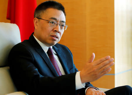 FILE PHOTO: Xiangchen Zhang, Chinese Ambassador to the World Trade Organization (WTO) attends an interview with Reuters in Geneva, Switzerland March 22, 2018. REUTERS/Denis Balibouse/File Photo