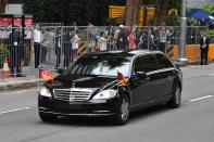 <p>A motorcade transporting North Korea’s leader Kim Jong Un sets off to Sentosa, the resort island where Kim is scheduled to meet with President Donald Trump for a U.S.-North Korea summit, from his hotel in Singapore on June 12, 2018. (Photo: Adek Berry/AFP/Getty Images) </p>