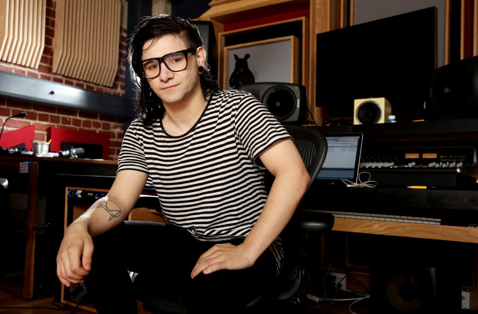 In this Thursday, March 6, 2014 photo, Skrillex, whose real name is Sonny Moore, poses for a portrait in Los Angeles. Skrillex is taking his inspiration from Kanye West these days. The electronic music DJ and producer spent a little time with West, sharing a plane flight from Los Angeles to Las Vegas where each was to perform two years ago, and came away with an invitation to collaborate and an even deeper understanding of the possibilities in front of him. (Photo by Matt Sayles/Invision/AP)