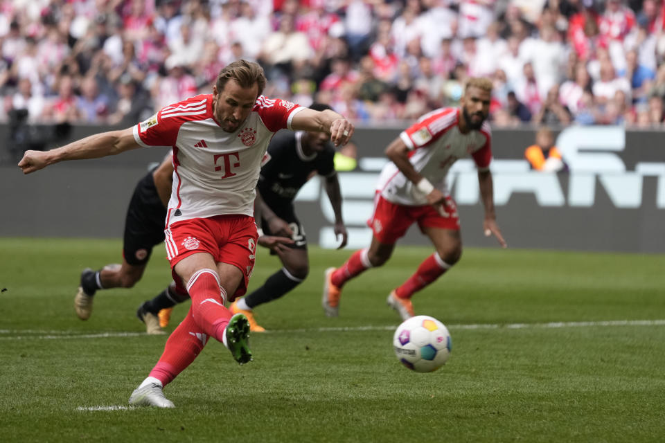 Bayern's Harry Kane scores his side's second goal from penalty during the German Bundesliga soccer match between Bayern Munich and Eintracht Frankfurt, at the Allianz Arena in Munich, Germany, Saturday, April 27, 2024. (AP Photo/Matthias Schrader)