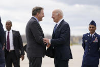 President Joe Biden speaks with New Hampshire Governor Chris Sununu after stepping off Air Force One at Portsmouth International Airport at Pease in Portsmouth, N.H., Tuesday, April 19, 2022. Biden is in New Hampshire to promote his infrastructure agenda. (AP Photo/Patrick Semansky)