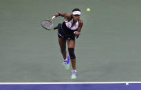 Naomi Osaka, of Japan, serves against Belinda Bencic, of Switzerland, during the fourth round of the US Open tennis championships Monday, Sept. 2, 2019, in New York. (AP Photo/Frank Franklin II)