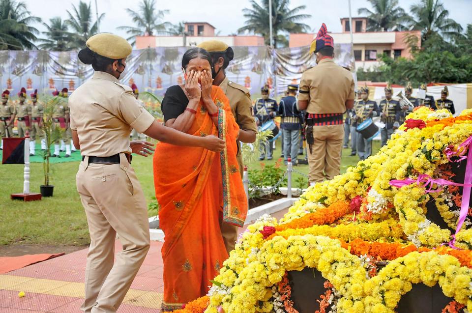 A family member of a martyr pays tribute on the occasion of National Police Commemoration Day, in Chikmagalur, Wednesday, 21 October, 2020.