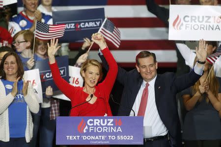 Republican U.S. presidential candidate Ted Cruz stands with Carly Fiorina after he announced Fiorina as his running mate at a campaign rally in Indianapolis, Indiana, United States April 27, 2016. REUTERS/Aaron P. Bernstein