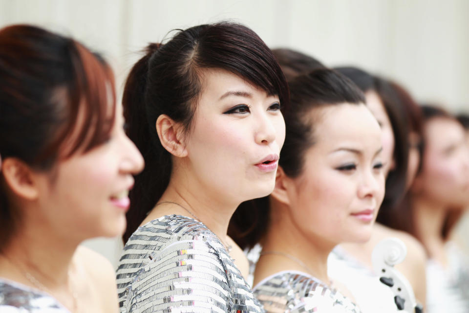 SHANGHAI, CHINA - APRIL 15: Grid girls attend the drivers parade before the Chinese Formula One Grand Prix at the Shanghai International Circuit on April 15, 2012 in Shanghai, China. (Photo by Mark Thompson/Getty Images)