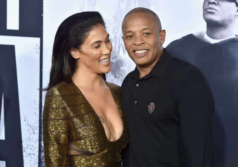 Nicole Young and record producer Dr. Dre smile for the cameras. 