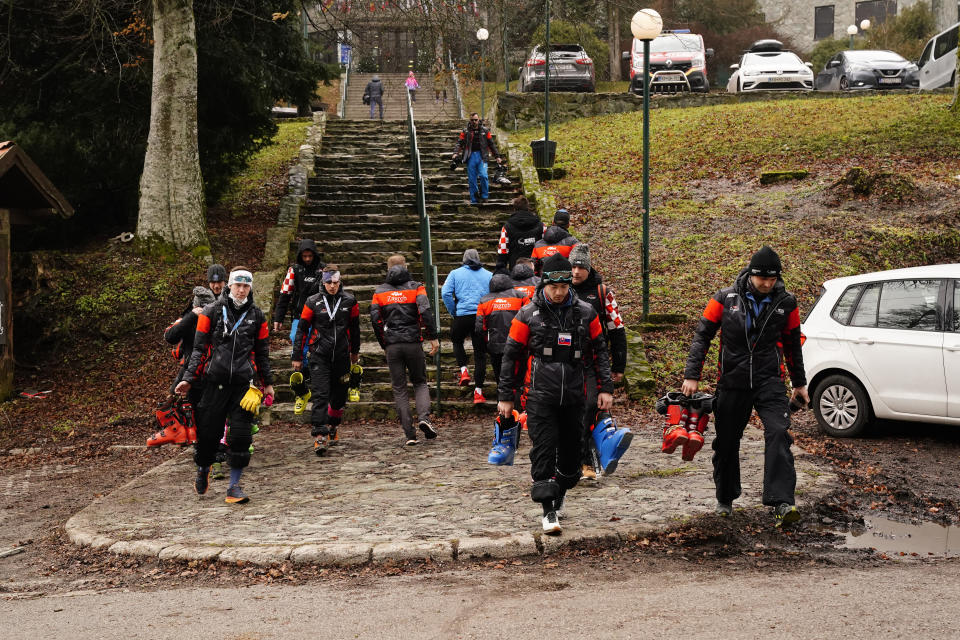 FILE - Course technicians return after an alpine ski, women's World Cup slalom race, in Zagreb, Croatia, was cancelled on, Jan. 5, 2023. Mother Nature and global warming are having just as much say about when and where to hold ski races these days as the International Ski Federation. Warm weather and a lack of snow wiped out nearly a month of racing at the start of this season. (AP Photo/Piermarco Tacca, File)