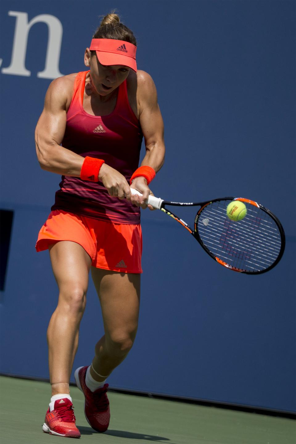 Halep of Romania returns a shot against Erakovic of New Zealand during their match at the U.S. Open Championships tennis tournament in New York