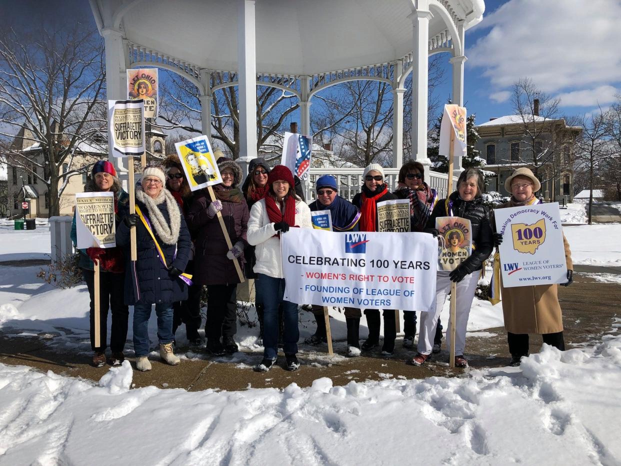 Members of the League of Women Voters of Hudson celebrate the 100th anniversary of the start of the local organization at the Hudson Gazebo.