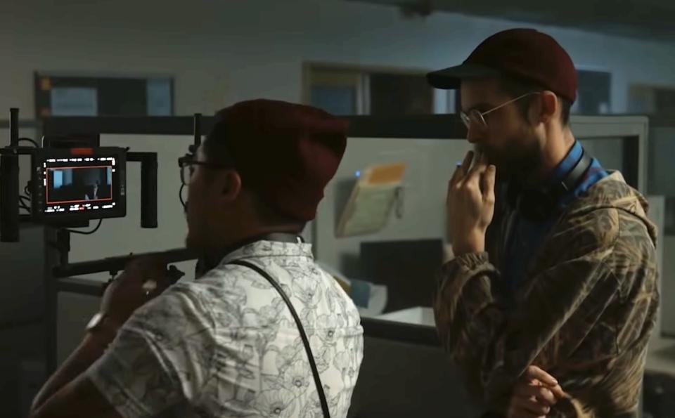 Dan Kwan and Daniel Scheinert examining a monitor on set