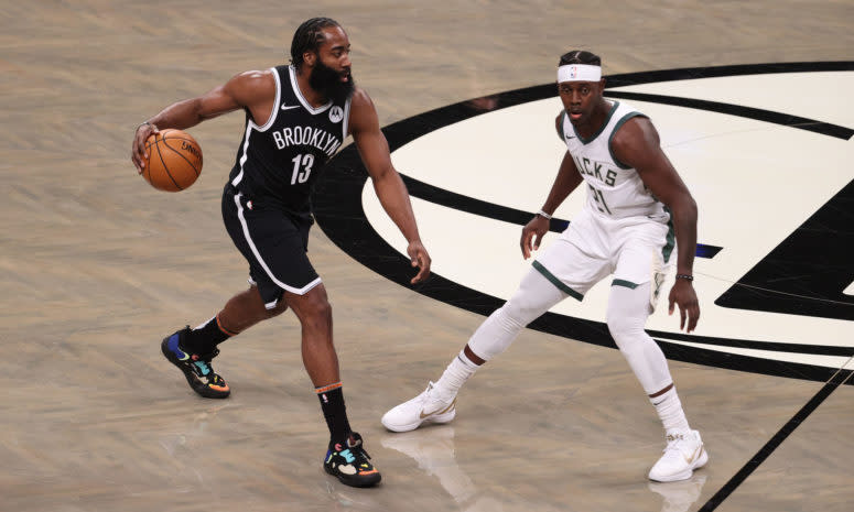 James Harden dribbling up the court for the Nets.