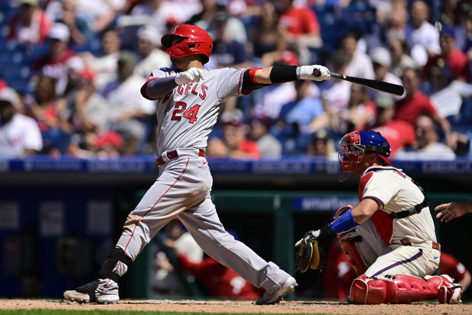 Los Angeles Angels' Kurt Suzuki hits an RBI-single off Philadelphia Phillies starting pitcher Kyle Gibson during the fourth inning of a baseball game, Sunday, June 5, 2022, in Philadelphia. (AP Photo/Derik Hamilton)