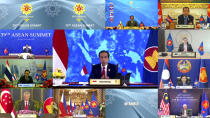 In this image released on Tuesday, Oct. 26, 2021, by Brunei ASEAN Summit in Bandar Seri Begawan, Indonesian President Joko Widodo, center, speaks during a virtual summit with the leaders of the Association of Southeast Asian Nations (ASEAN) member​ states. Southeast Asian leaders began their annual summit without Myanmar on Tuesday amid a diplomatic standoff over the exclusion of the leader of the military-ruled nation from the group's meetings. An empty box of Myanmar is seen at bottom second from right. (Brunei ASEAN Summit via AP)