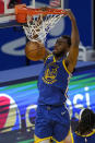 Golden State Warriors forward Andrew Wiggins (22) dunks against the Cleveland Cavaliers during the second half of an NBA basketball game in San Francisco, Monday, Feb. 15, 2021. (AP Photo/Jeff Chiu)