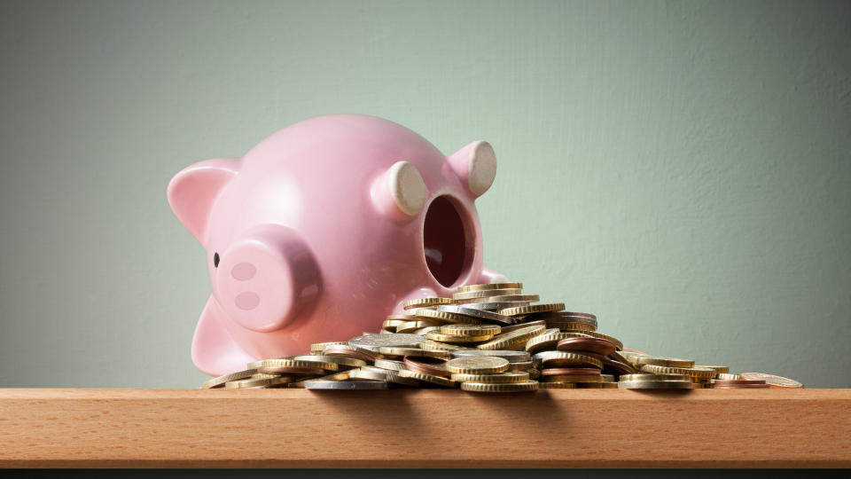 Piggy bank with euro coins on the shelf.