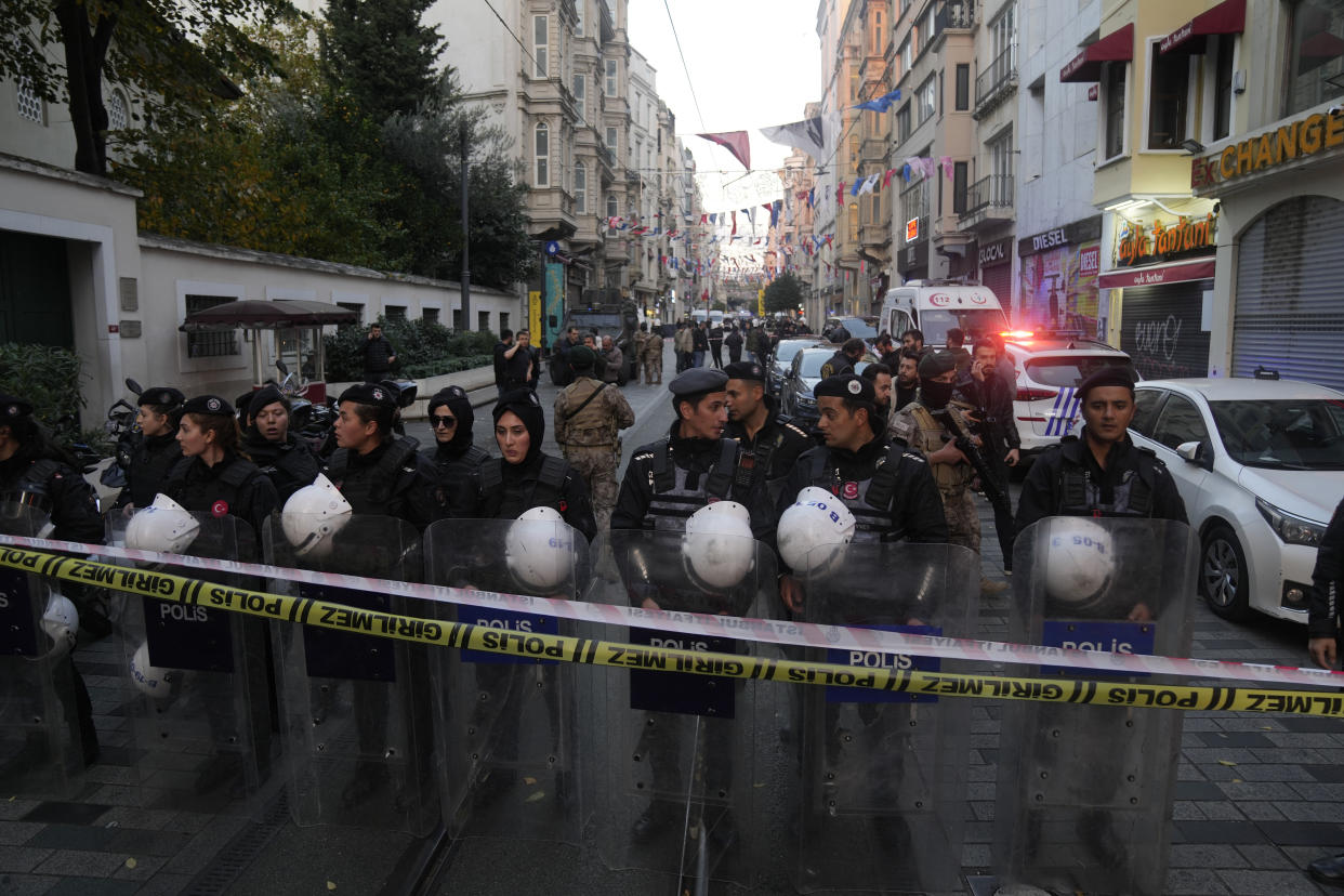 Security and ambulances at the scene after an explosion on Istanbul's popular pedestrian Istiklal Avenue, Sunday, Nov. 13, 2022. Istanbul Gov. Ali Yerlikaya tweeted that the explosion occurred at about 4:20 p.m. (1320 GMT) and that there were deaths and injuries, but he did not say how many. The cause of the explosion was not clear. (AP Photo/Francisco Seco)