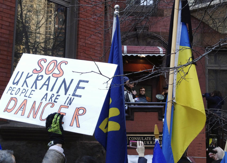 CORRECTS TO UKRAINIAN CONSULATE INSTEAD OF EMBASSY - Ukrainians gather outside the Ukrainian Consulate in Chicago, Wednesday, Feb. 19, 2014, to protest the deadly violence in the capital of Kiev and call for a stronger response by the United States and the European Union. Clashes on Tuesday left 25 people dead in the worst violence in nearly three months of anti-government protests in Ukraine's capital. Protests began after the president backed away from a deal to join the European Union. (AP Photo/Tammy Webber)