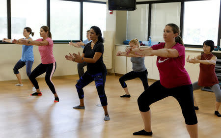 Dr. Anu Puttagunta, endocrinologist (2nd R), participates with hospital staff in a MOVE exercise class at Saint Joseph Mercy hospital in Ypsilanti, Michigan, U.S., August 23, 2017. Picture taken August 23, 2017. REUTERS/Rebecca Cook