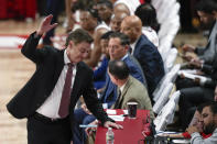 St. John's head coach Rick Pitino hits a table during the second half of an NCAA college basketball game against Stony Brook, Tuesday, Nov. 7, 2023, in New York. St. John's defeated Stony Brook 90-74. (AP Photo/Seth Wenig)
