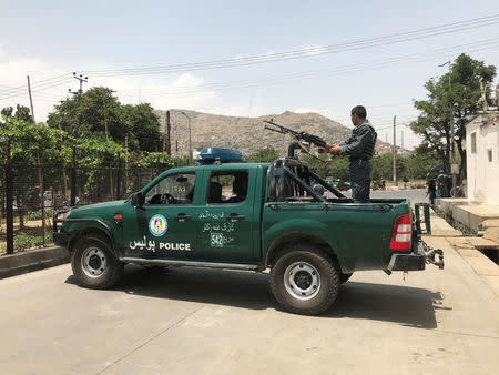 An Afghan police officer keeps watch at the site of a blast in Kabul, Afghanistan June 4, 2018. REUTERS/Omar Sobhani