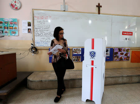 A woman walks at a polling station during the parliamentary election in Beirut, Lebanon, May 6, 2018. REUTERS/Jamal Saidi
