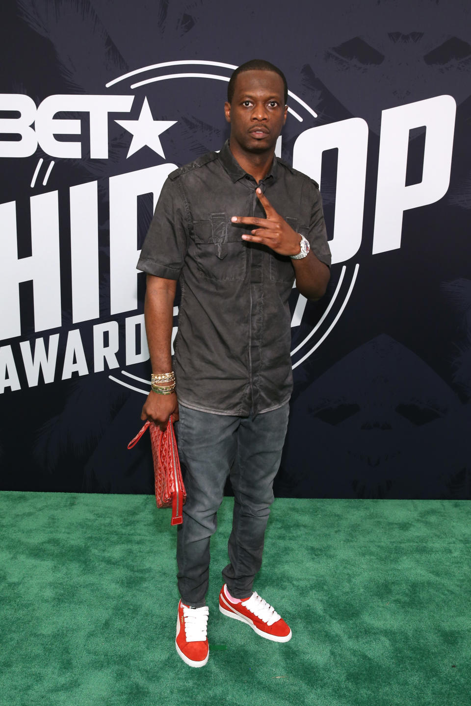 Pras Michel wearing red shoes