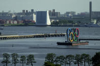 The Olympic Rings float on a barge at Odaiba Marine Park as Tokyo prepares for the 2020 Summer Olympics, Friday, July 16, 2021. The pandemic-delayed games open on July 23 without spectators at most venues. (AP Photo/Charlie Riedel)