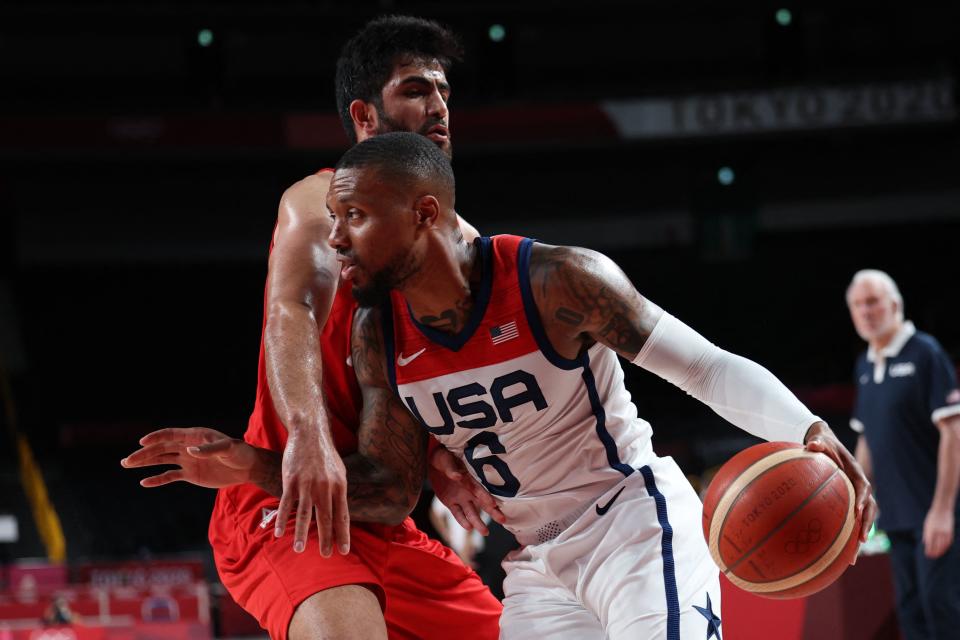 Damian Lillard (6) and Team USA bounced back from a loss to France by blowing out Iran. (Photo by THOMAS COEX/AFP via Getty Images)