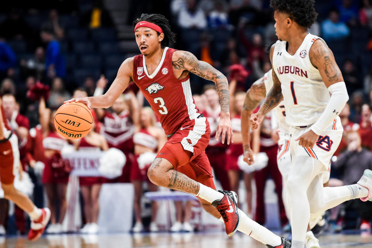 NASHVILLE, TENNESSEE - MARCH 9: Nick Smith Jr. #3 of the Arkansas Razorbacks drives down the court against the Auburn Tigers during the first half of the second round of the 2023 SEC Men's Basketball Tournament at Bridgestone Arena on March 9, 2023 in Nashville, Tennessee. (Photo by Carly Mackler/Getty Images)