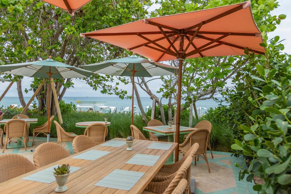 A palette of oceanic blues and greens mixed form the background of the outdoor dining experience at Seaway at Four Seasons Resort Palm Beach.