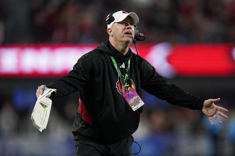 Louisville coach Jeff Brohm reacts after a play during the second half of the team's Atlantic Coast Conference championship NCAA college football game against Florida State, Saturday, Dec. 2, 2023, in Charlotte, N.C. (AP Photo/Erik Verduzco)