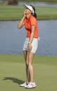 Michelle Wie reacts to winning the 2014 LPGA LOTTE Championship golf tournament on the 18th green at Ko Olina Golf Club, Saturday, April 19, 2014, in Kapolei, Hawaii. (AP Photo/Eugene Tanner)