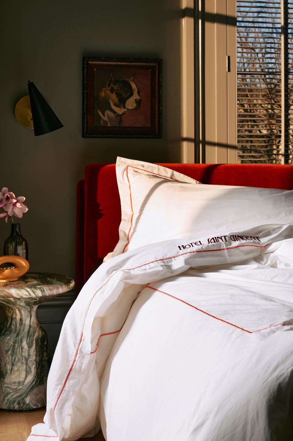 The red velvet bed frames are custom-made, and each room is equipped with a vintage phone. (Make a long call, and twirl the cord like it's the old days.)