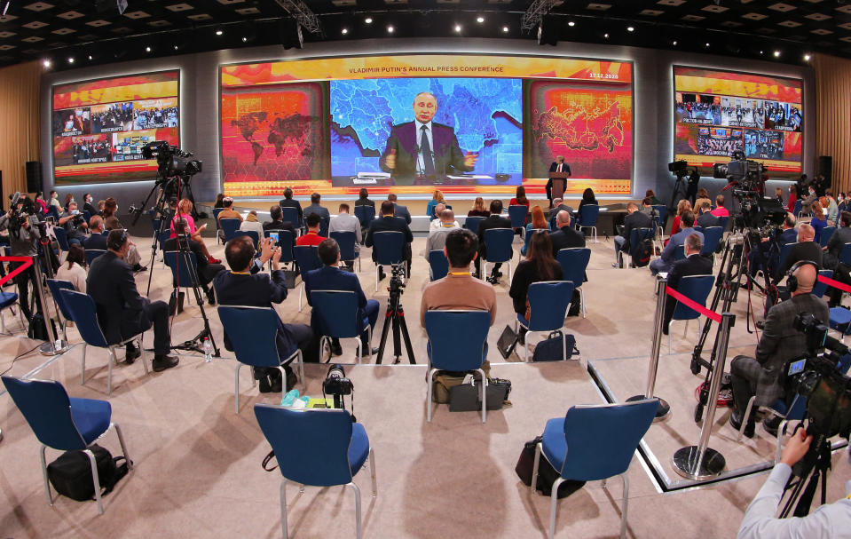 Russian President Vladimir Putin gestures as he speaks via video call during a news conference in Moscow, Russia, Thursday, Dec. 17, 2020. This year, Putin attended his annual news conference online due to the coronavirus pandemic. (AP Photo/Alexander Zemlianichenko)