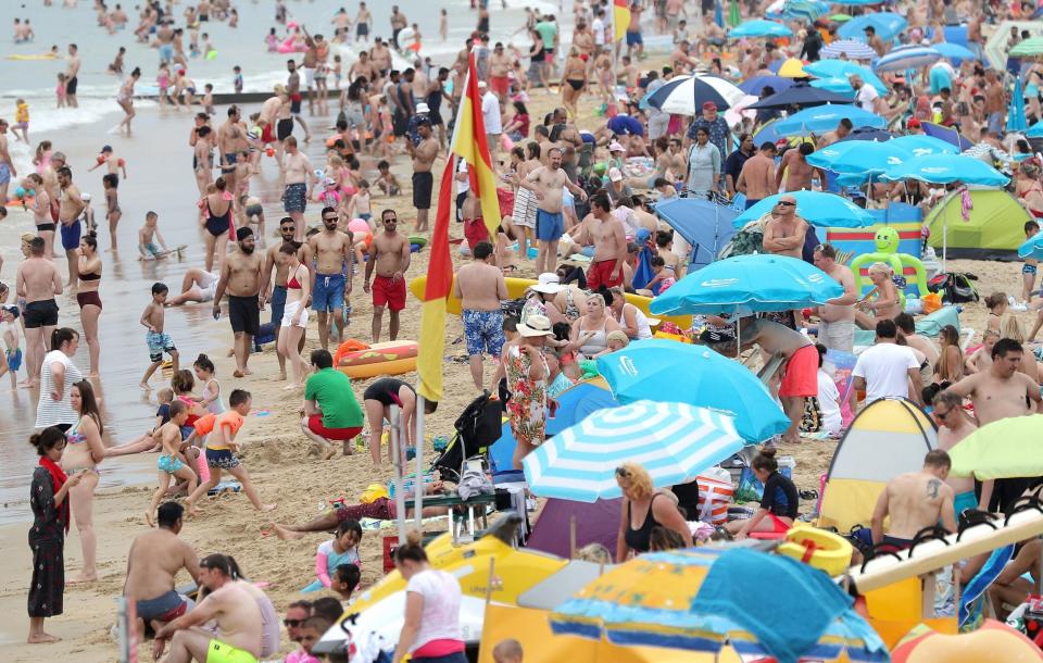 Sun lovers flocked to Bournemouth beach to enjoy the sunshine: PA