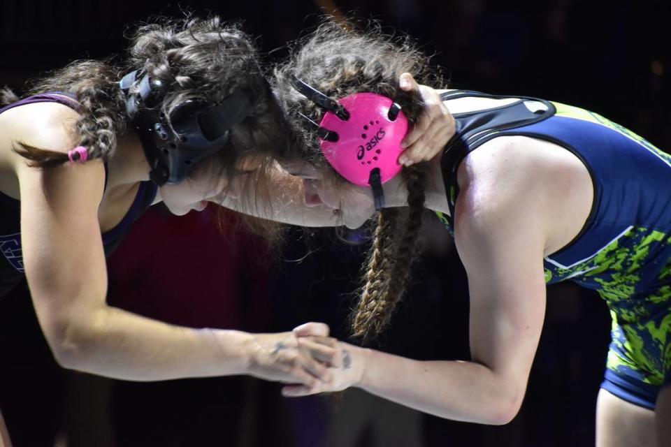 Haslet Eaton’s Neelie Parker and Paschal’s Elizabeth Dyer compete in the UIL state wrestling championships in Cypress, Texas on Feb. 17, 2024.