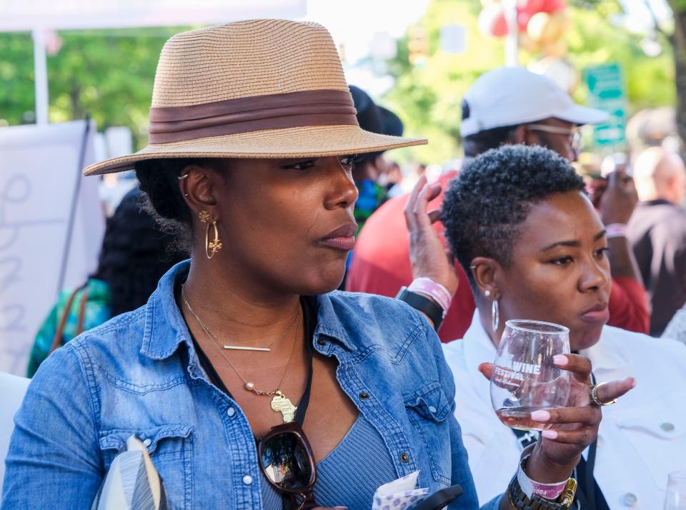 The Food and Wine Festival moved to Main Avenue in downtown Northport Sunday, April 30, 2023. Monica Peterson enjoys the festival. 