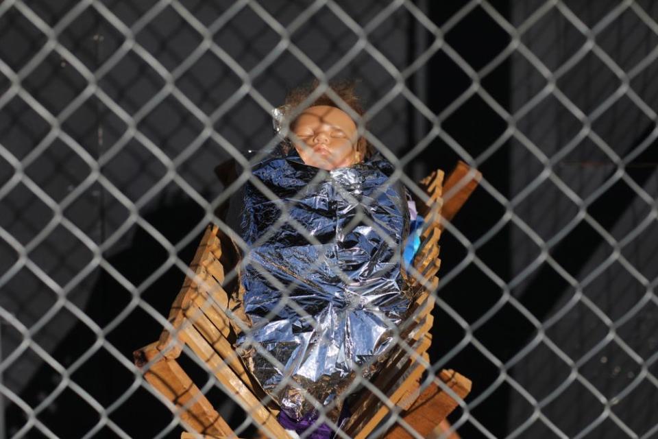 A statue of Baby Jesus in the cage
