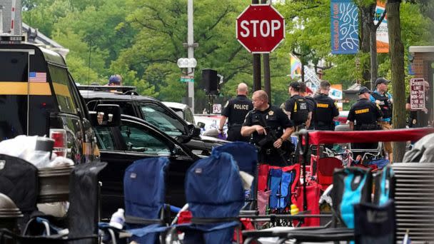 PHOTO: Law enforcement search after a mass shooting at the Highland Park Fourth of July parade in downtown Highland Park, Ill., on Monday, July 4, 2022.  (Nam Y. Huh/AP)
