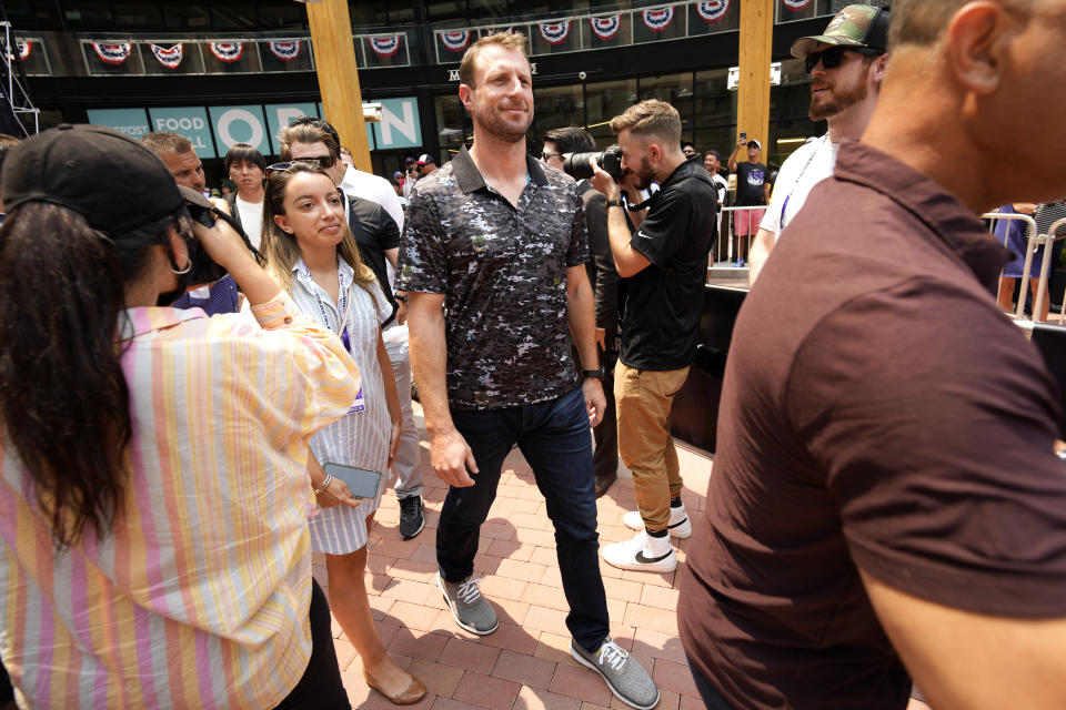 Max Scherzer, of the Washington Nationals, arrives to a news conference to be named the National League's starting pitcher for the MLB All-Star baseball game, Monday, July 12, 2021, in Denver. (AP Photo/David Zalubowski)