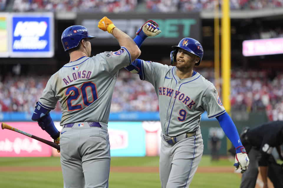 New York Mets' Brandon Nimmo (9) celebrates with Pete Alonso after hitting a home run against Philadelphia Phillies pitcher Orion Kerkering during the seventh inning of Game 2 of a baseball NL Division Series, Sunday, Oct. 6, 2024, in Philadelphia. (AP Photo/Chris Szagola)