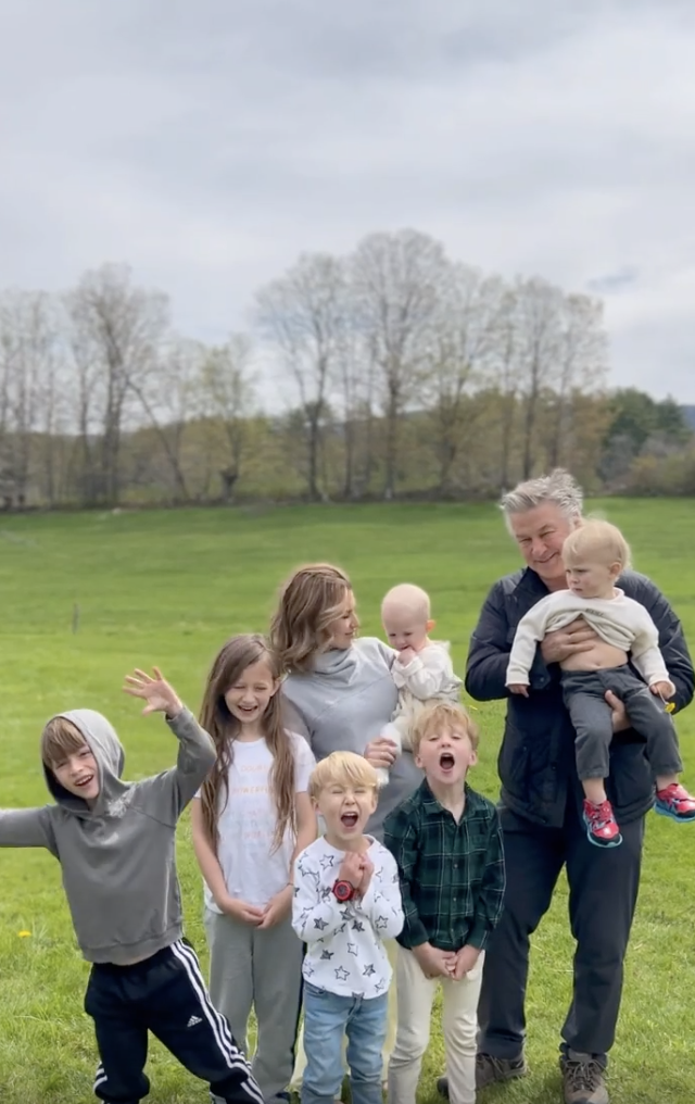 The Baldwin family standing in a field of grass