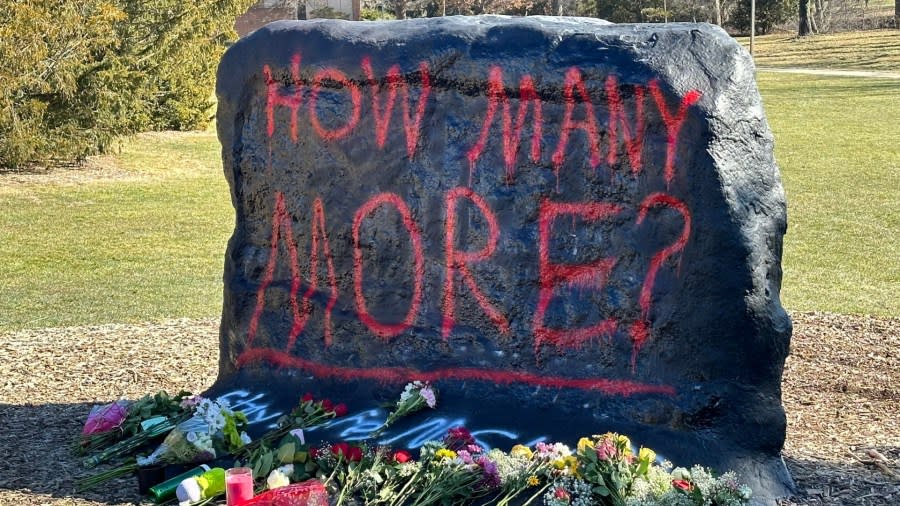 The Rock at MSU reads, "How many more?" on the day after a shooting killed three students and injured five others. (Feb. 14, 2023)