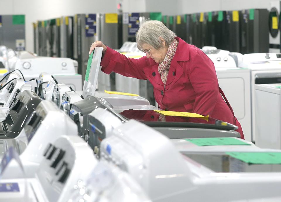 Joan Fedelischak of Streetsboro shops for a washing machine Tuesday at the new Lowe's Outlet in Cuyahoga Falls.