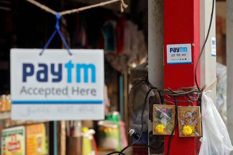 Advertisements of Paytm, a digital wallet company, are seen placed at stalls of roadside vegetable vendors in Mumbai