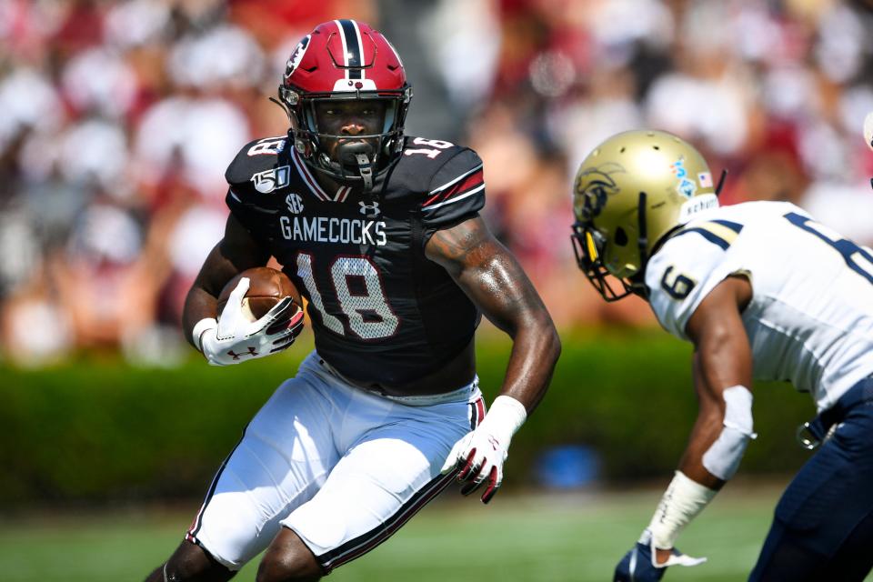 South Carolina wide receiver OrTre' Smith (18) runs with the ball after a catch against Charleston Southern in a 2019 home game.