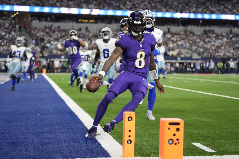 Baltimore Ravens quarterback Lamar Jackson (8) runs the ball for a touchdown against the Dallas Cowboys in the first half of an NFL football game in Arlington, Texas, Sunday, Sept. 22, 2024. (AP Photo/Julio Cortez)