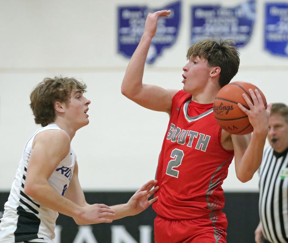 Canton South's Poochie Snyder, right, motions for a teammate against CVCA's Charley Levak during the first half of a high school basketball game, Friday, Dec. 15, 2023, in Cuyahoga Falls, Ohio.