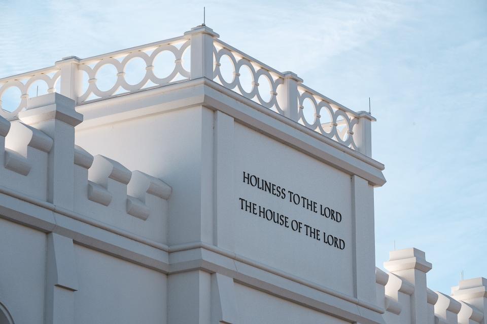 The words “Holiness to the Lord” and “The House of the Lord” are shown on the St. George Utah Temple on Dec. 9, 2023.